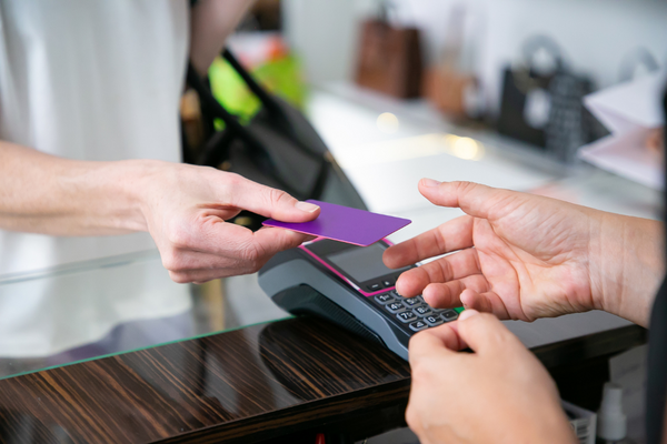 Customer handing over gift card